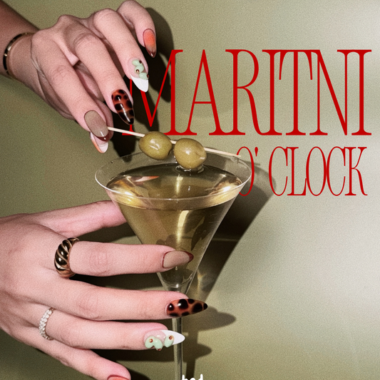 Hand holding a martini glass with olives, text 'Martini O'Clock', and brand name 'Bad Mood' on a green background.